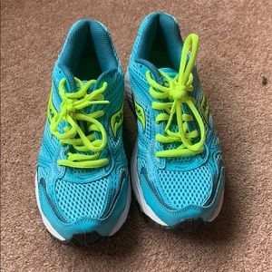 Blue and neon green saucony shoes